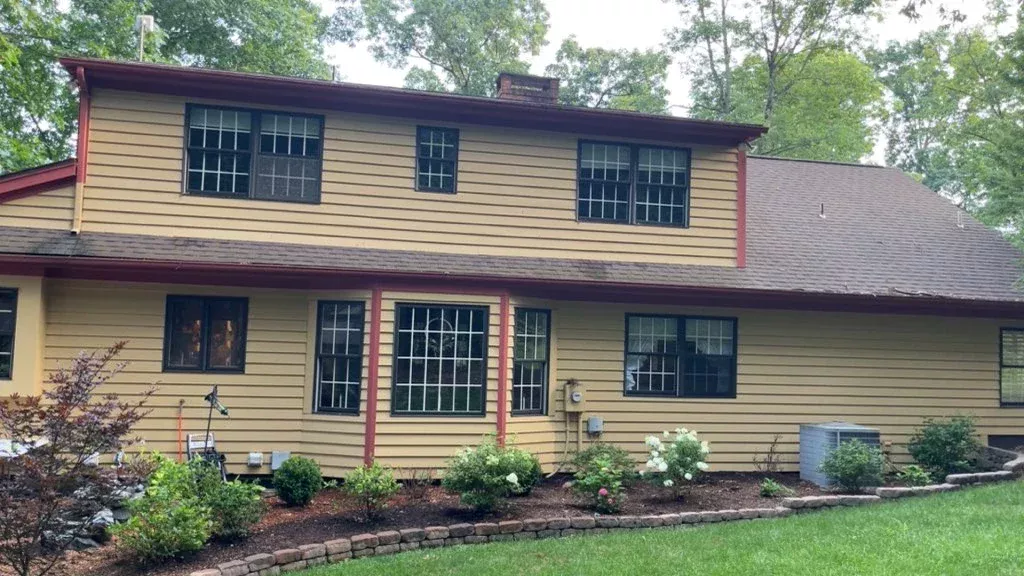 Tan two-story Pennsylvania home with streak-free windows