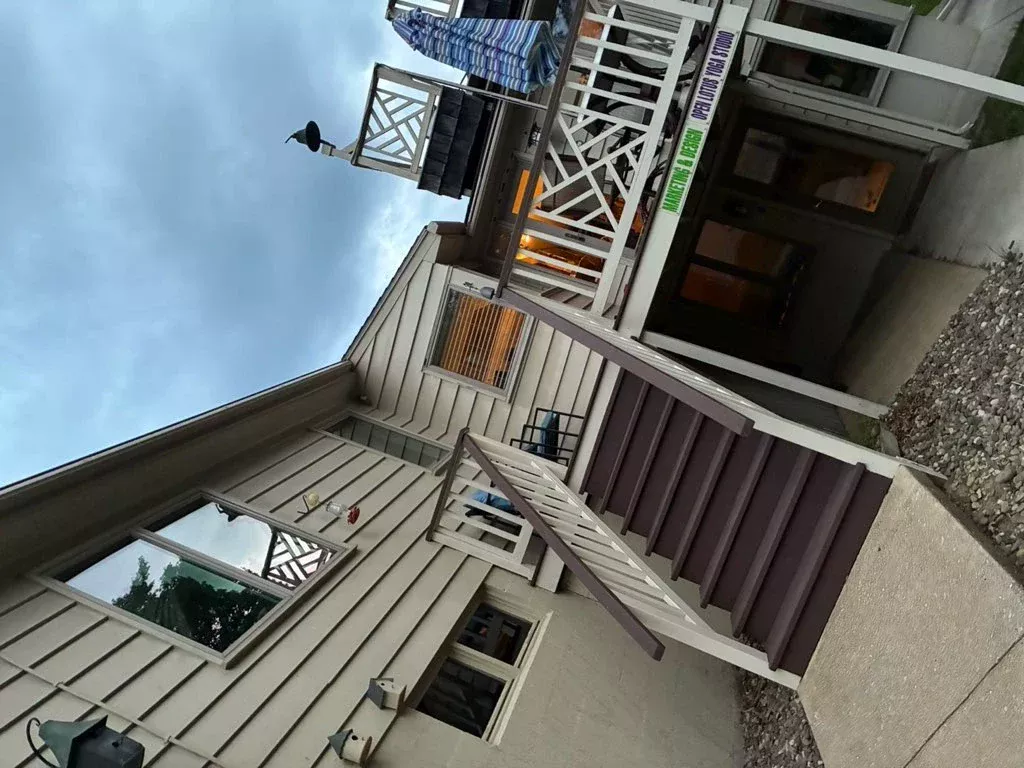 Clean second-story windows and deck on a Pennsylvania house